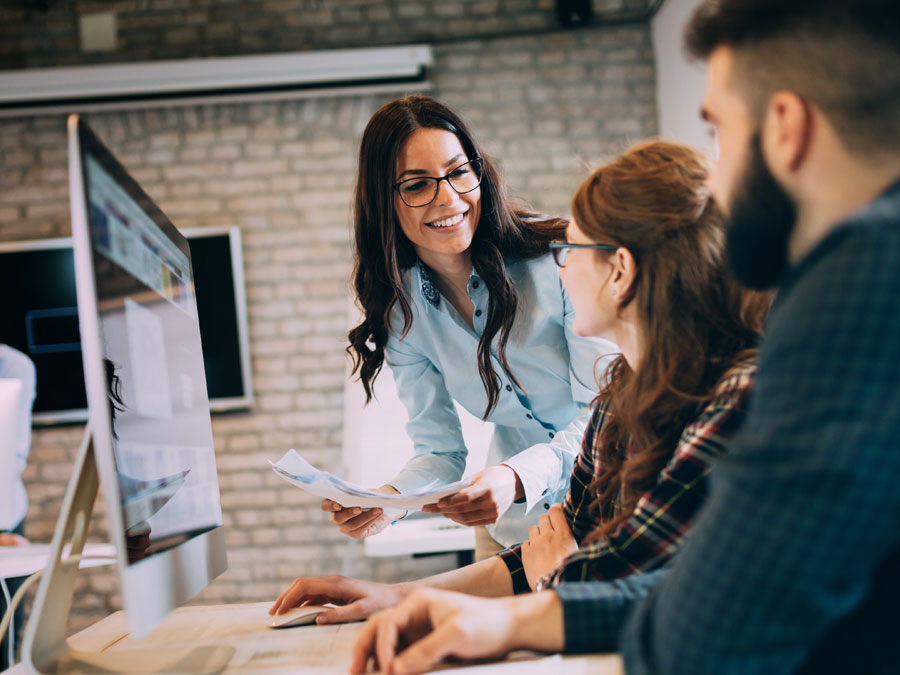 call center team leader helping technical support agents