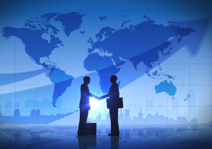 business-men-shaking-hands-map-background