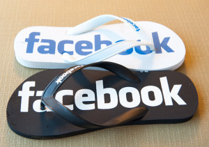 white-and-black-slippers-with-facebook-text-logo