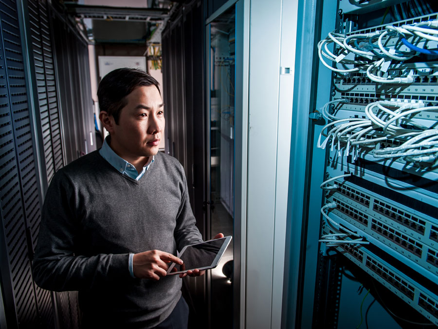 IT manager inspecting servers