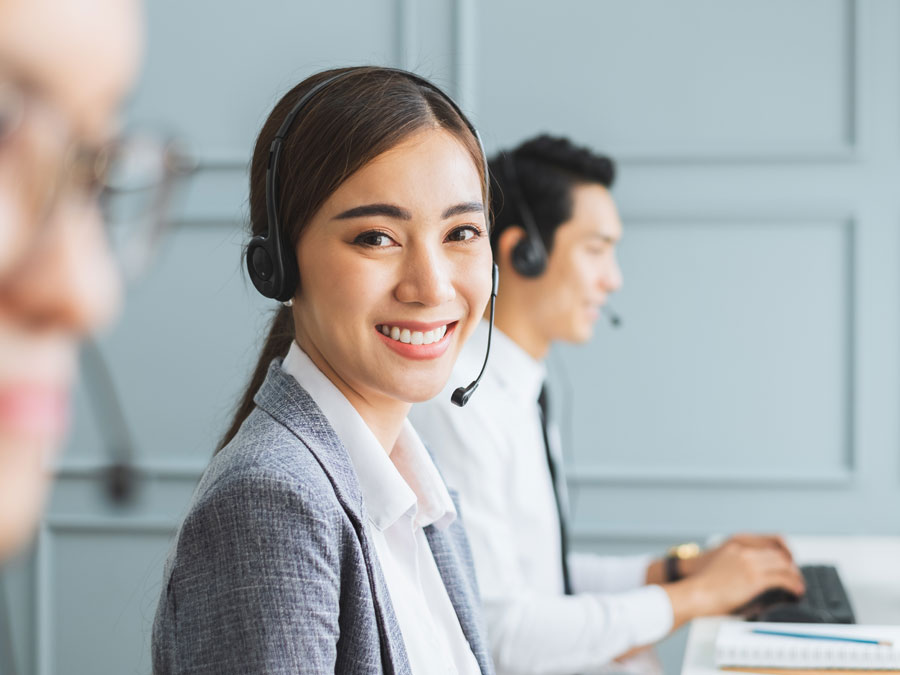 Philippine call center disaster recovery CX agent smiling in office