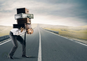 businessman-carrying-luggage-across-the-street