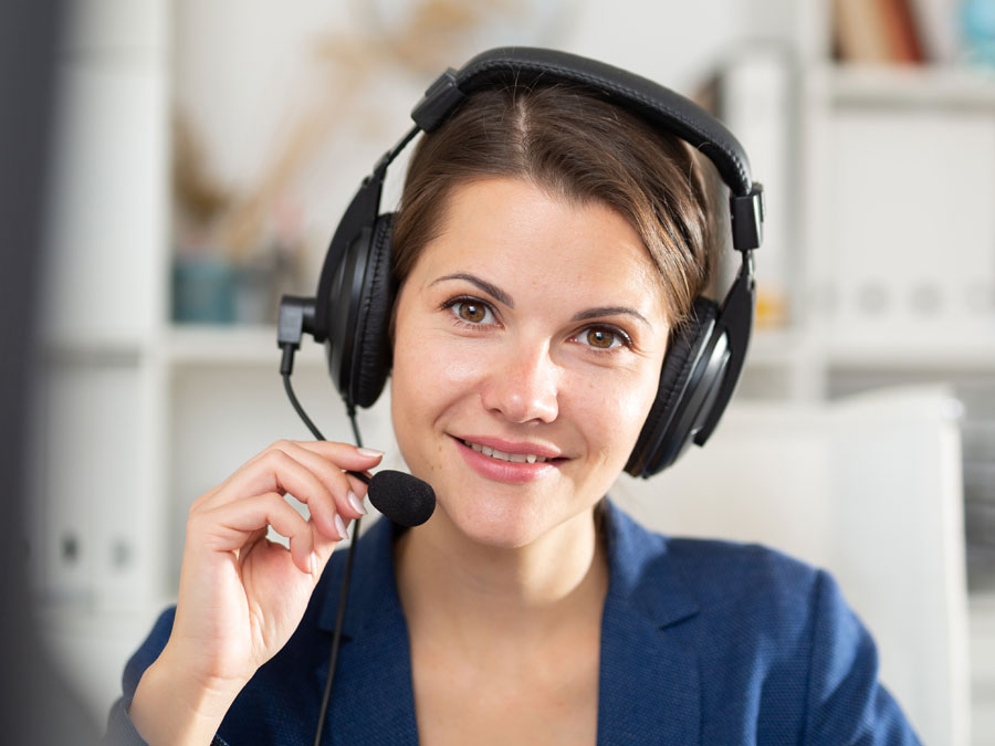 smiling German call center agent in customer support department