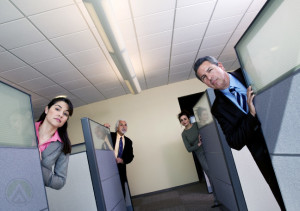 call-center-agents-peeking-at-their-work-stations