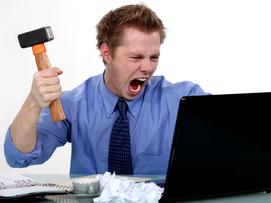 customer service outsourcing agent angry with laptop