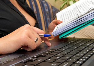 female-pointing-on-laptop-keyboard