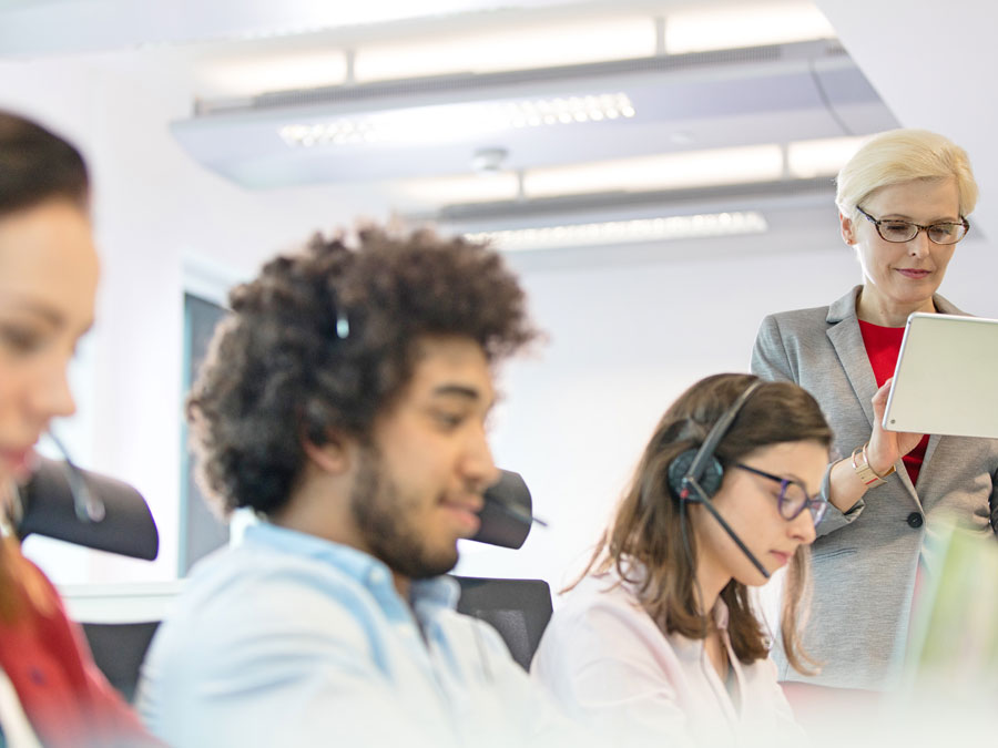 diverse call center employees with team leader