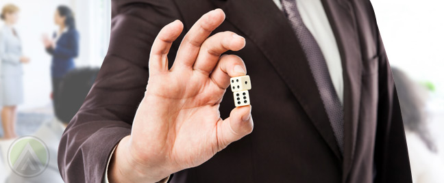 male-hand-holding-dice