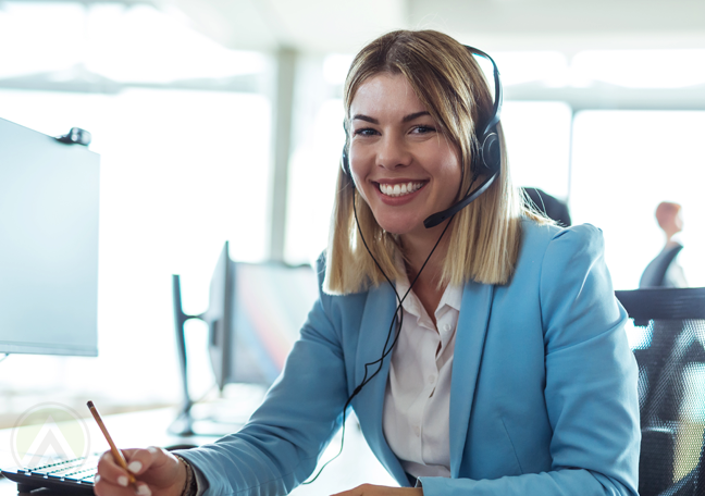 brightly smiling female call center agent at work