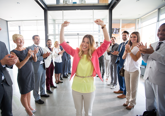 office employees applauding millennials coworker