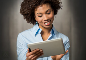 smiling-female-call-center-agent-holding-a-tablet