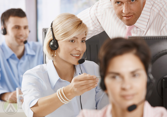 call-center-manager-and-agent-listening-to-recorded-calls--Open-Access-BPO--
