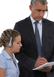 call-center-manager-and-agent-listening-to-recorded-calls--Open-Access-BPO---