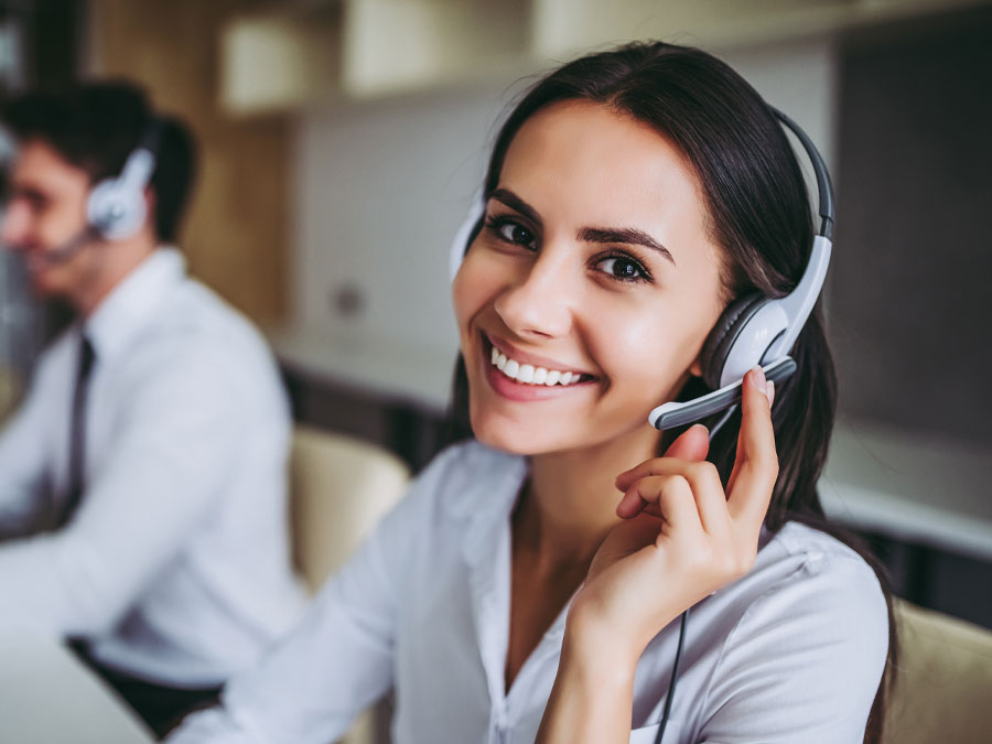 call quality monitoring depiction smiling CX agent showing consistency in customer support call center