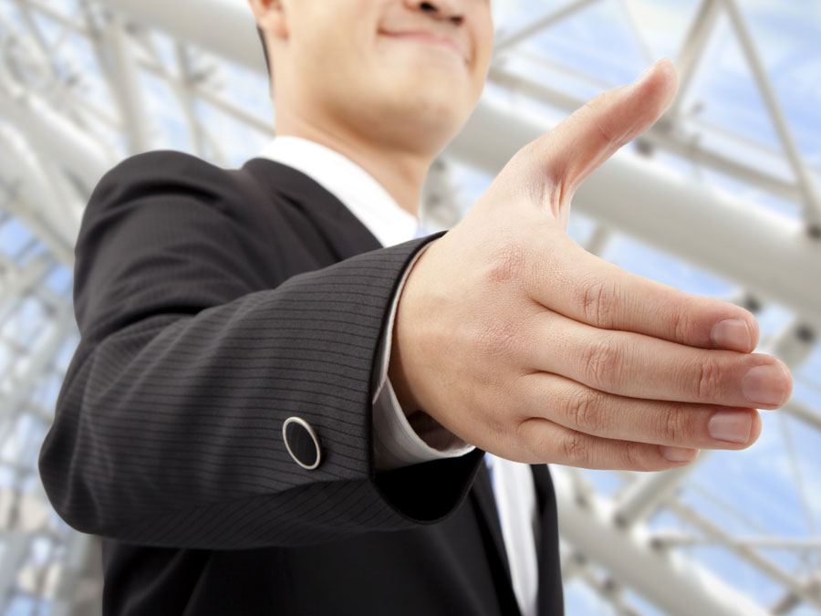 businessman offering to shake hands