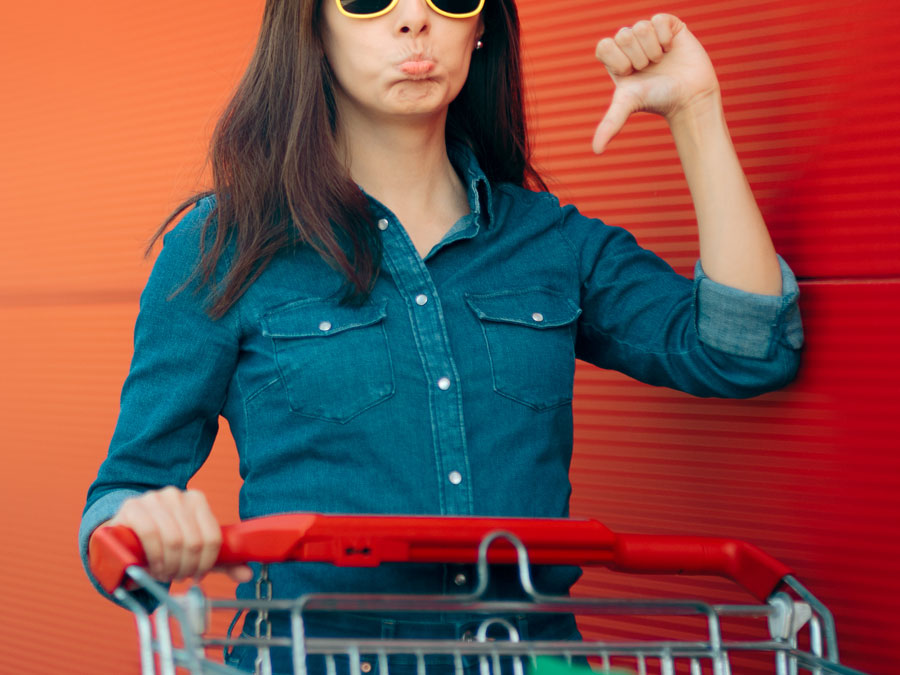 crowdsourcing content moderation depiction brand reputation risk woman shopper thumbs down dissappointed with shopping cart