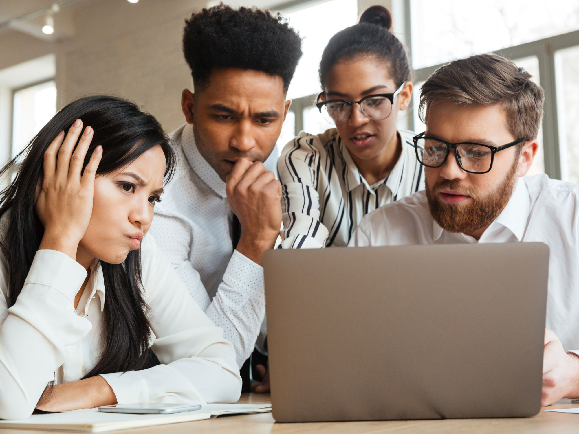 crowdsourcing content moderation team looking at laptop