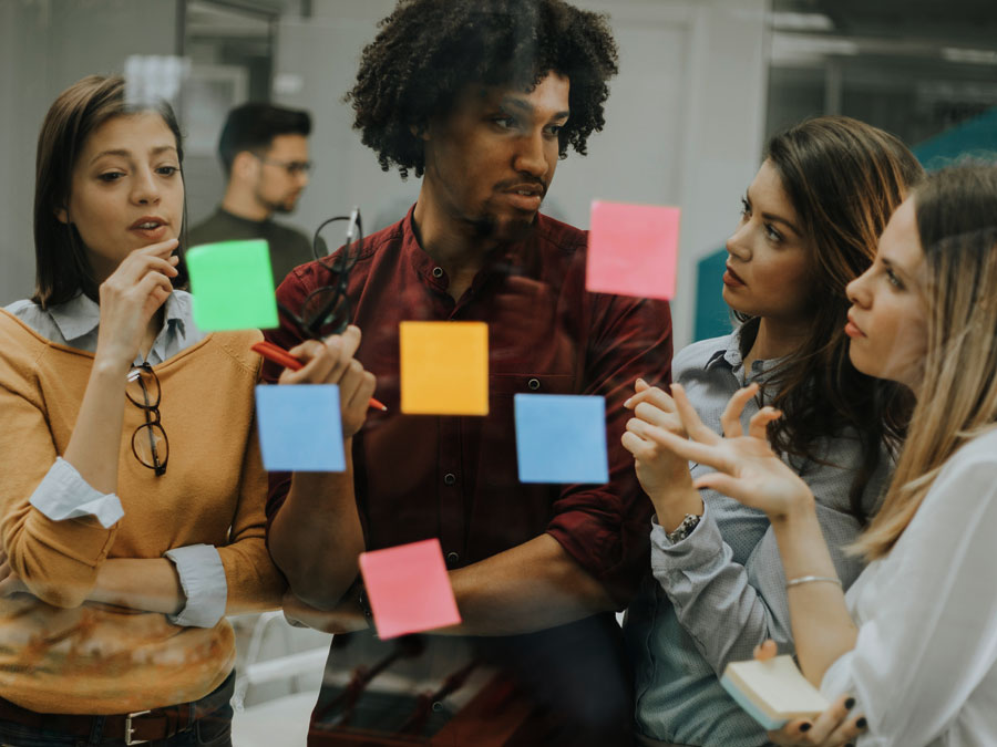 business team discussing post it notes