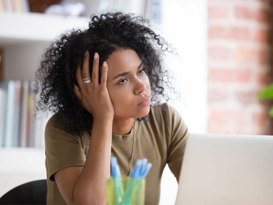 frustrated woman using laptop annoyed with customer support