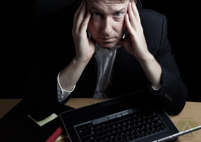 male-night-shift-employee-with-headache