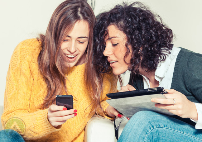 young-millennial-girls-looking-at-smartphone