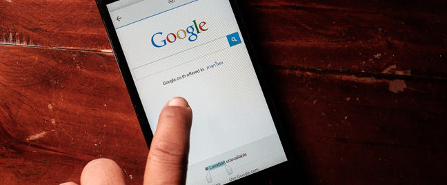 finger-tapping-smartphone-on-Google-search