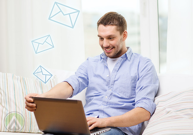 man-with-laptop-satisfied-with-emails