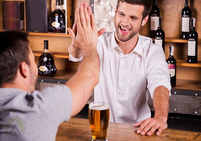 Bartender-giving-a-high-five-to-a-customer-great-customer-experience