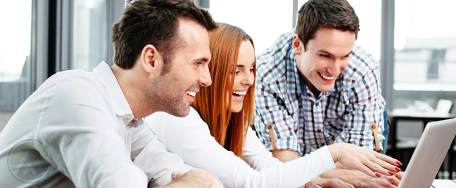 male-female-web-designer-looking-at-laptop