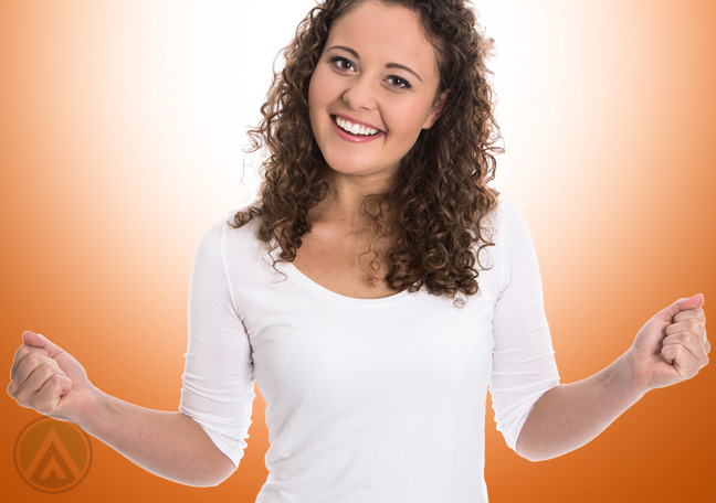 smiling-female-in-orange-background