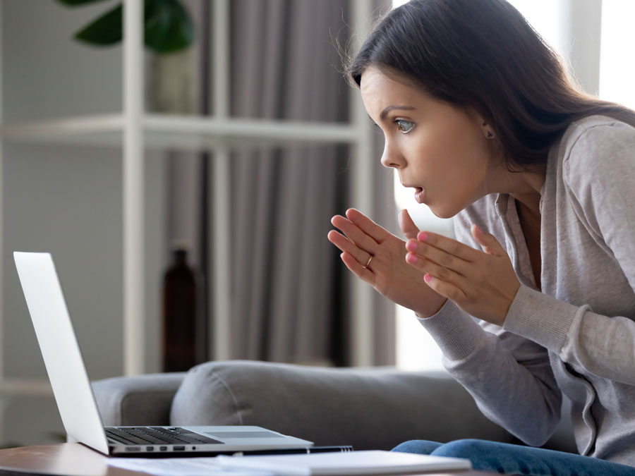 user generate content surprised looking at laptop