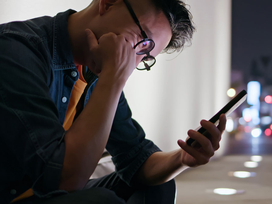 user generated content bothering young man looking at phone