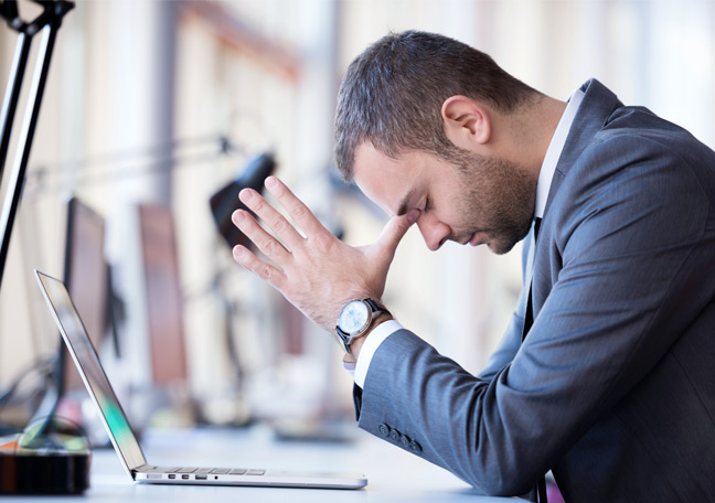 businessman-having-a-bad-day-in front of-laptop