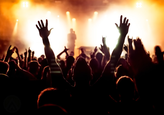 fans-raising-hands-during-concert