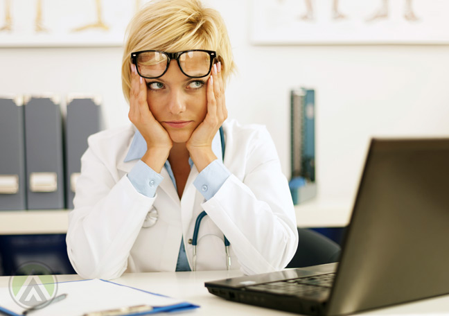 female-medical-practitioner-doctor-in-front-of-laptop