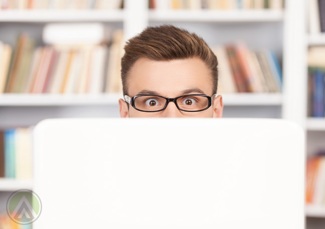 surprised-businessman-behind-laptop