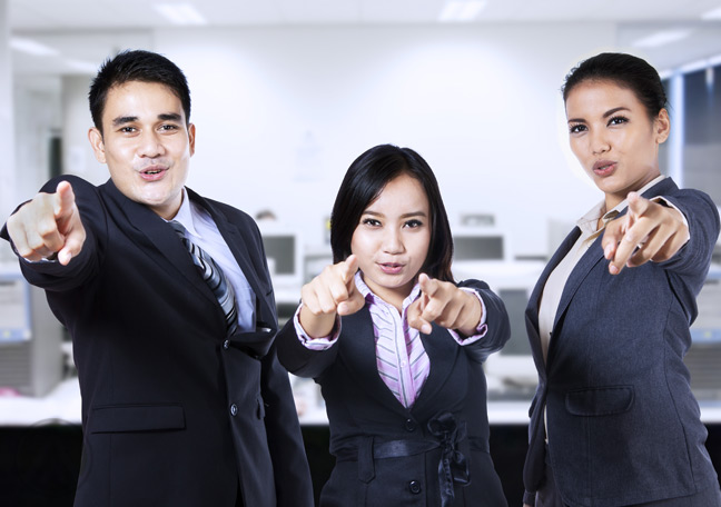 male-female-call-center-workers-pointing