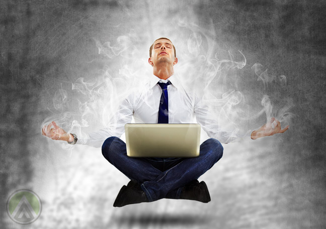 meditating-glowing-floating-businessman-with-laptop