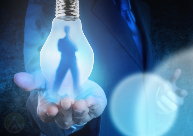 business-holding-lightbulb-with-human-shadow-figure-inside