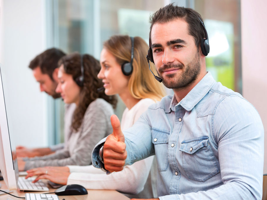 call centers agent giving thumbs up in customer support office