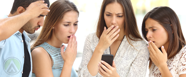 diverse-group-of-young-people-shocked-at-smartphone