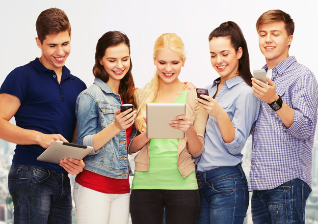 group-of-diverse-young-people-using-smartphones-tablets