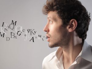 young man with letters coming out of mouth