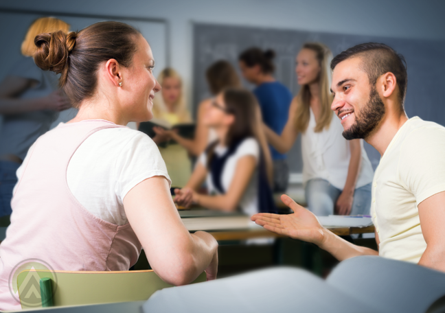young-people-chatting-in-a-classroom-surrounded-by-people