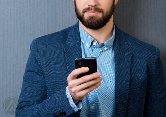 bearded-businessman-using-smartphone