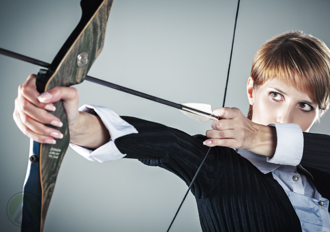 female-business-executive-aiming-a-bow-and-arrow