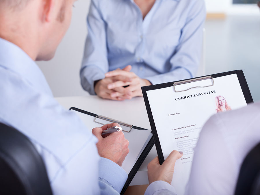 HR personnel panel interviewing tech support applicant