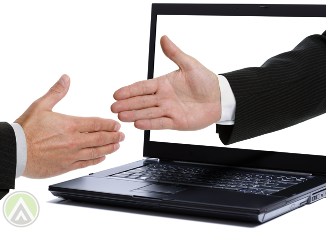businessmen-shaking-hands-through-laptop-monitor