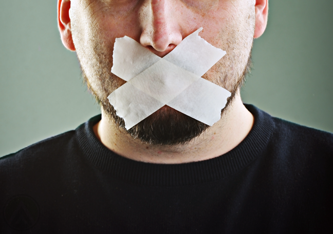 bearded-man-with-tapes-covering-mouth