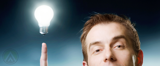 businessman-with-bright-idea-pointing-to-light-bulb